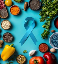 A vibrant flat lay of healthy foods, a colon cancer pamphlet, and a blue ribbon on a kitchen table HD 8k, high-end retouching, --ar 6:5 --v 6.1 Job ID: 0217d084-976f-4bea-8b35-496bf3093d9f